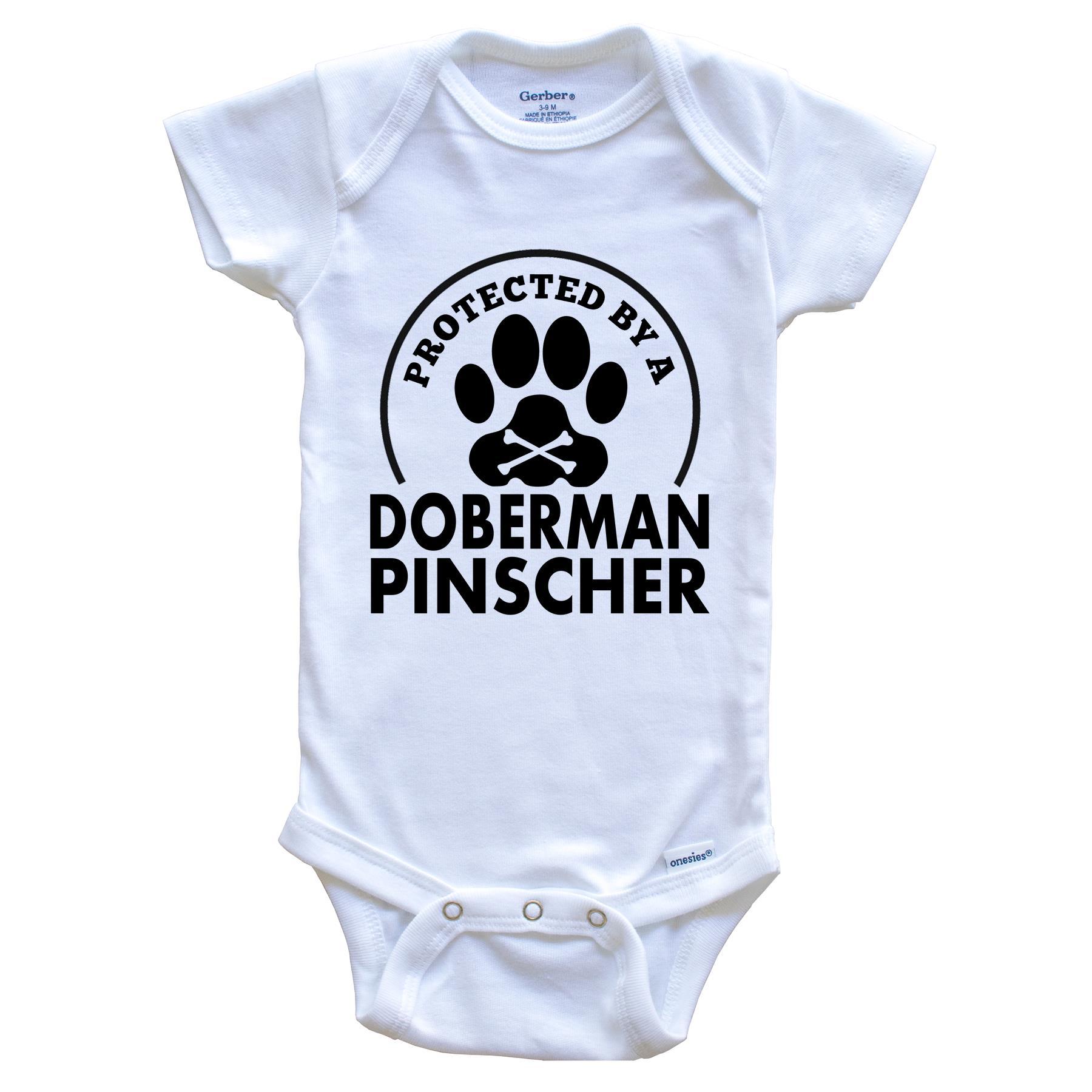 Protected By A Doberman Pinscher Funny Baby Onesie